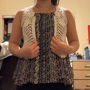 Black tribal print top with a white lace vest